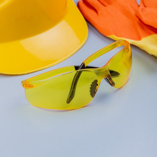 side view of pattern from set of construction tools as safety glasses gloves safety helmet